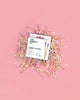 Pink cotton swabs stacked in a neat arrangement on a pink background, creating a vibrant pink display.